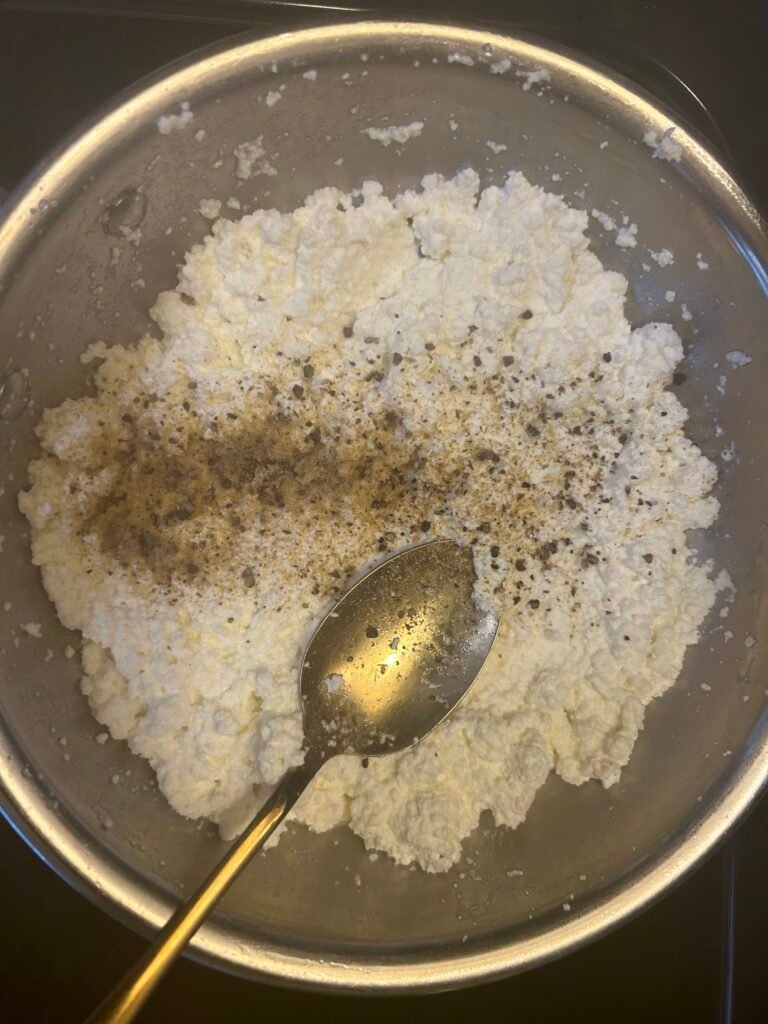 Cardamom powder added to thickened Kalakand mixture
